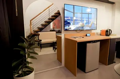 an office with a desk and a staircase at Havitat Boutique Hotel in Manila