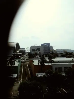 a view of a city with palm trees and buildings at MOA Rental in Manila