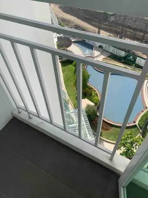 an overhead view of a balcony with a view of the water at Lovely Spacious Condo With Balcony in Manila