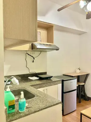 a kitchen with a sink and a counter top at Pacific Residences Condo Del Juana Near BGC Taguig in Manila