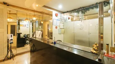 a room with a counter and a glass wall at Peace Hotel by RedDoorz in Manila