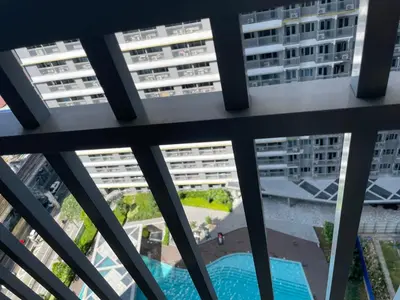 a view from the balcony of a building with buildings at Condominium Fame Residence in Manila