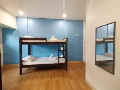 a room with a bunk bed with a mirror at Sulit Condo Unit Santa Mesa Manila in Manila