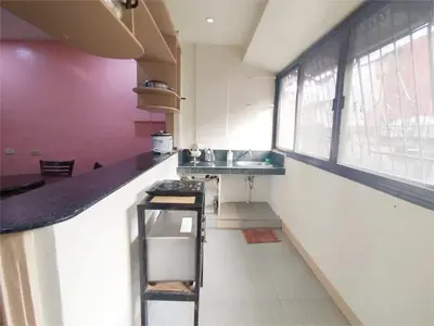 a kitchen with a counter and a sink and some windows at Sulit Condo Unit Santa Mesa Manila in Manila