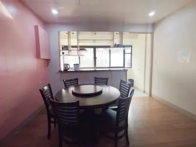 a dining room with a table and chairs at Sulit Condo Unit Santa Mesa Manila in Manila