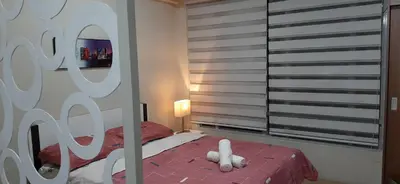 a bedroom with a bed with a white stuffed animal on it at Cozy City View Condo @ Newport NAIA T3 Airport & RWM in Manila