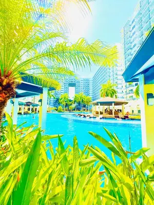 a view of the pool at a resort at Shell Residence MOA Manila by JO Alano in Manila