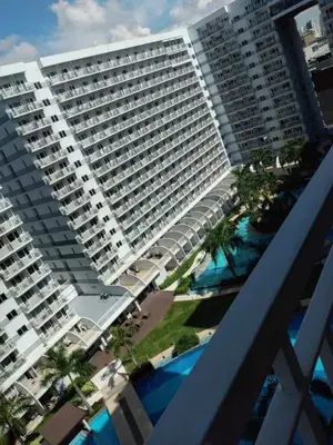 an aerial view of a large apartment building with a pool at SHELL RESIDENCE c2 shortwalk Mall of Asia near Airport in Manila