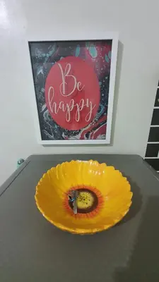 a table with a yellow pumpkin with a knife in it at Sea Residences EZBedz in Manila