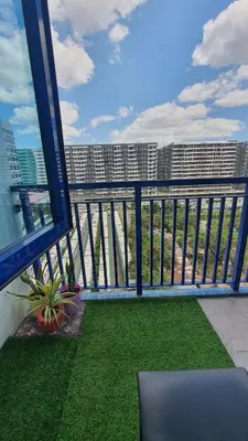 a balcony with a view of a city skyline at Sea Residences EZBedz in Manila