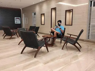 a man wearing a gas mask sitting in a waiting room at SMDC Coast Residences - Entire 1BR Condo with stunning view from 24th Floor in Manila