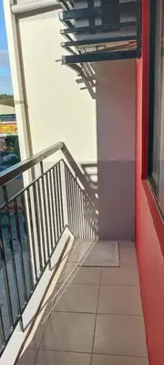 a balcony of a building with a view of the ocean at 2-Bedroom Condo in Imus Cavite with UNLI WIFI, 50