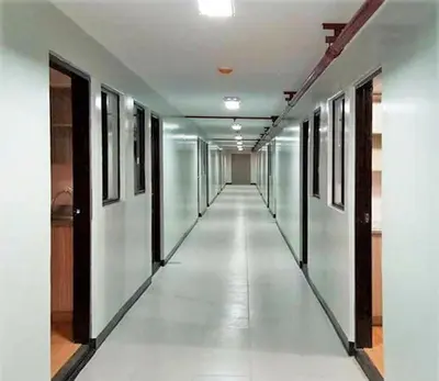 an empty hallway in a building with white walls at 2-Bedroom Condo in Imus Cavite with UNLI WIFI, 50