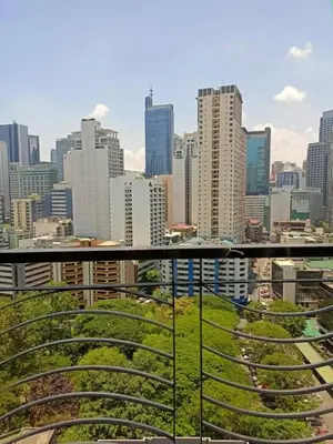 a view of a city skyline with tall buildings at 16E 1 BR Mosaic staycation in Manila