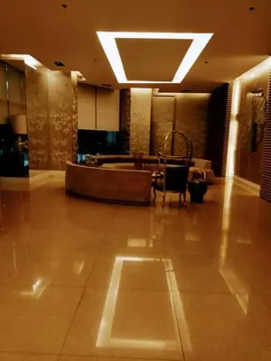 a large lobby with a tub in the middle of a building at 16E 1 BR Mosaic staycation in Manila