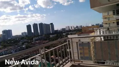 a view of a city from a balcony of a building at New Avida JVB Homestyle in Manila