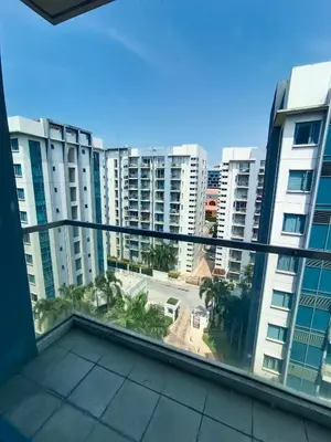 a balcony with a view of a city at Palm Tree Two Villas in Manila