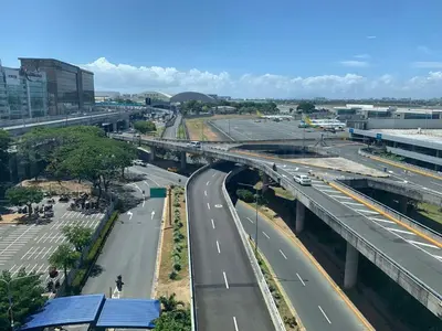 an overhead view of a highway in a city at 150 Newport Boulevard Near NAIA Terminal 3 in Manila