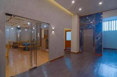 an empty room with tables and chairs in a building at MySpace Hotel Comembo Taguig in Manila