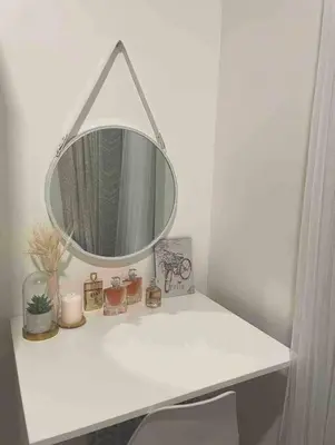 a bathroom with a white counter with a mirror at Cozy 1BR with balcony at Fame Residences in Manila