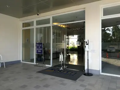 an entrance to a building with a revolving door at SM South Residences, 1 bedroom with balcony. in Manila