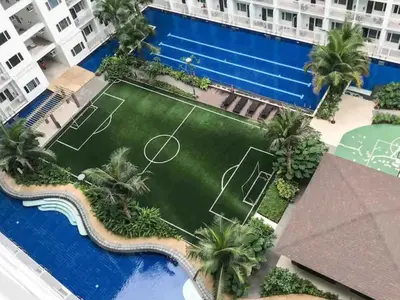 an aerial view of a tennis court in a resort at Chic Nordic Condo Unit at Shore Residences Mall of Asia in Manila