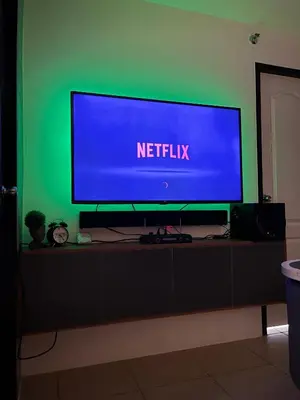 a flat screen tv sitting on top of a table at Marvel Suite Staycation -Near Doña Elena Tower in Manila