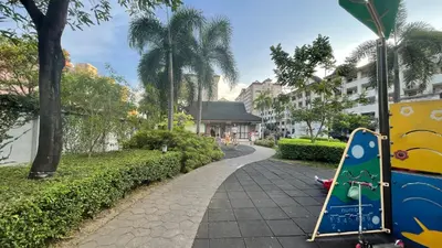 a walkway in a park with a playground at Marvel Suite Staycation -Near Doña Elena Tower in Manila