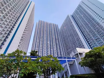 three tall buildings with trees in front of them at Gabriel's Den @ JazzB1109 in Manila
