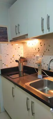 a kitchen with a sink and a counter top at Gabriel's Den @ JazzB1109 in Manila
