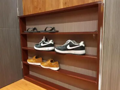 a shelf with three pairs of shoes on it at Stay Amare Green Residences Kristina in Manila