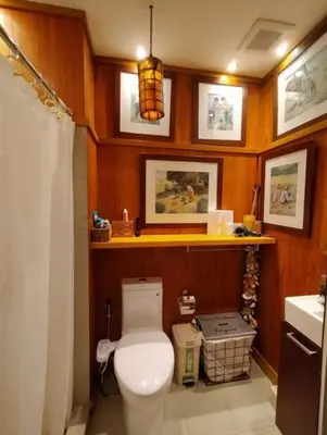 a bathroom with a toilet and a sink at Stay Amare Green Residences Kristina in Manila