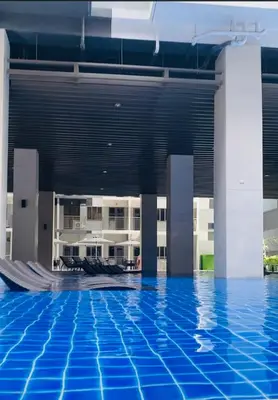 a view of a swimming pool in a building at S Residences-MOA in Manila