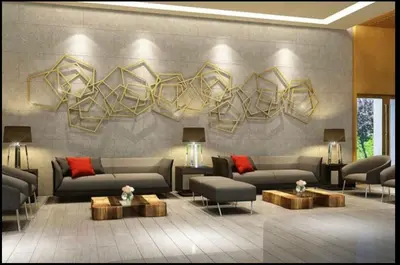 a living room with couches and tables and a wall at S Residences-MOA in Manila