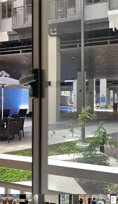 a view of a courtyard from a window at S Residences-MOA in Manila