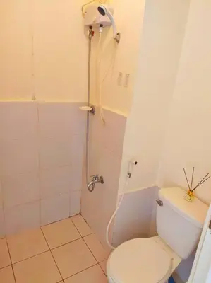 a bathroom with a shower and a toilet in it at Great View@Fully Equipped Condo w/ WiFi NETFLIX @the Metro in Manila