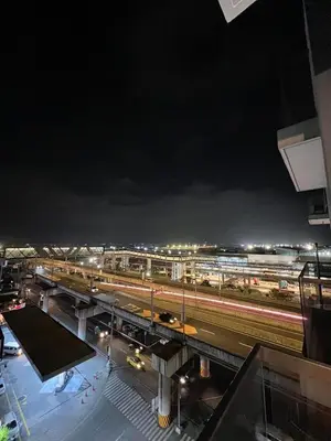 a view of a train station at night at Luxury Hotel Type Condo near NAIA Manila Airport in Manila
