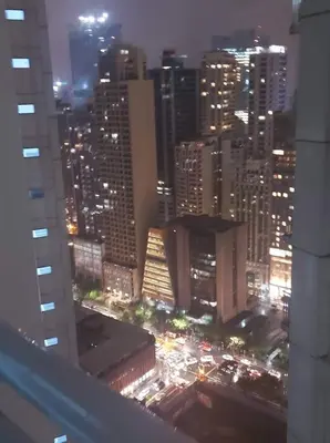 a view of a city skyline at night at SMDC Jazz Residences in Manila