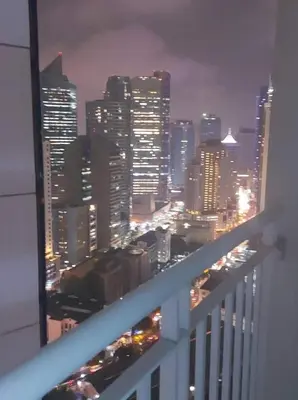 a view of a city skyline at night at SMDC Jazz Residences in Manila