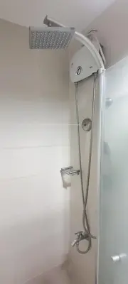 a shower in a bathroom with a shower head at SMDC Jazz Residences in Manila