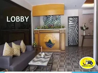 a living room with a couch and a table at Sunmiles Condominium - 2BR unit M26 in Calamba