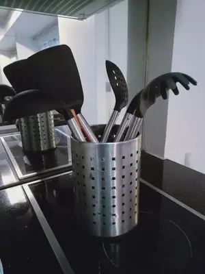 a metal container filled with utensils on a stove at 2 Bedrooms Units Forbes Area 5th Avenue BGC Center in Manila