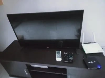 a flat screen tv sitting on top of a table at 2 Bedrooms Units Forbes Area 5th Avenue BGC Center in Manila