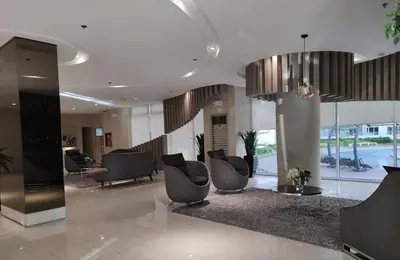 a lobby with couches and chairs in a building at Apad@graceresidences nr BGC in Manila