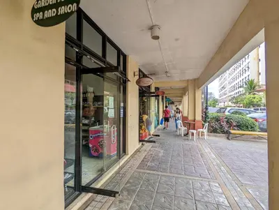 a storefront of a store with people walking down a street at Budget 1BR Loft Apartment in Cainta Cambridge Village in Cainta