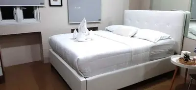 a white bed with two rabbits on top of it at ZG-150Newport in Manila