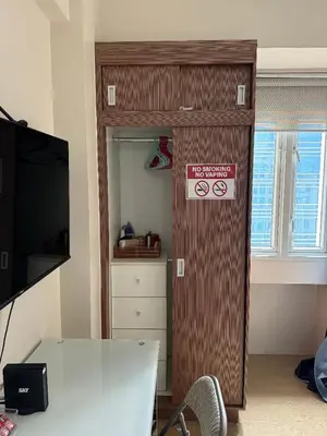 a room with a door with a sign on it at ZG-150Newport in Manila