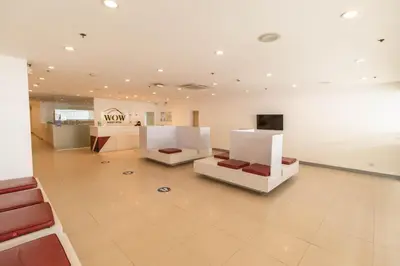 a living room with two chairs and a couch at Wow Budget Hotel Cubao in Manila