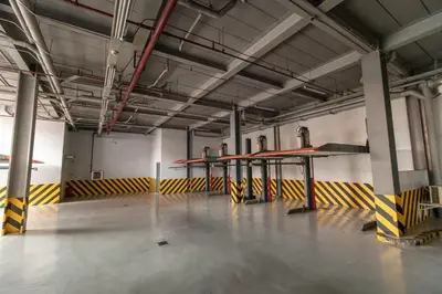 an empty room with a row of tables in it at Wow Budget Hotel Cubao in Manila