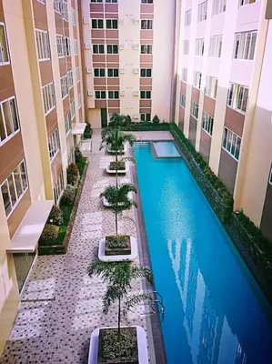 an overhead view of a swimming pool in a building at Lilian Stanford Suites 2 South Forbes Inchican Silang Cavite in Silang